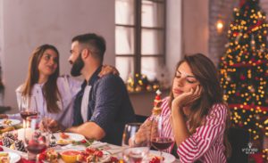 Stressed woman at Christmas dinner