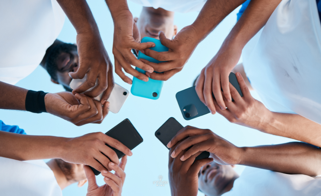 Hands, phone and app with people in a huddle or circle for communication or connectivity.