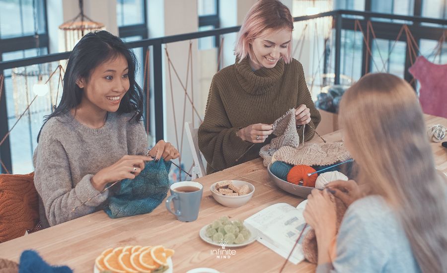 Young attractive girls in a knitting lesson