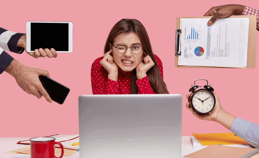 Indoor shot of upset Caucasian woman plugs ears, ignores bad sound, wears spectacles, clenches teeth from displeasure, unrecognizable people demonstrate watch, document with pie chart, gadgets