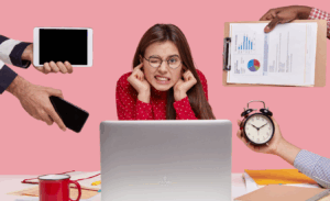 Indoor shot of upset Caucasian woman plugs ears, ignores bad sound, wears spectacles, clenches teeth from displeasure, unrecognizable people demonstrate watch, document with pie chart, gadgets