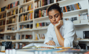 A woman in a library reading