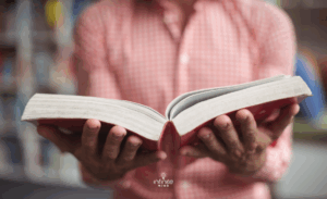 Mid section of a book in library