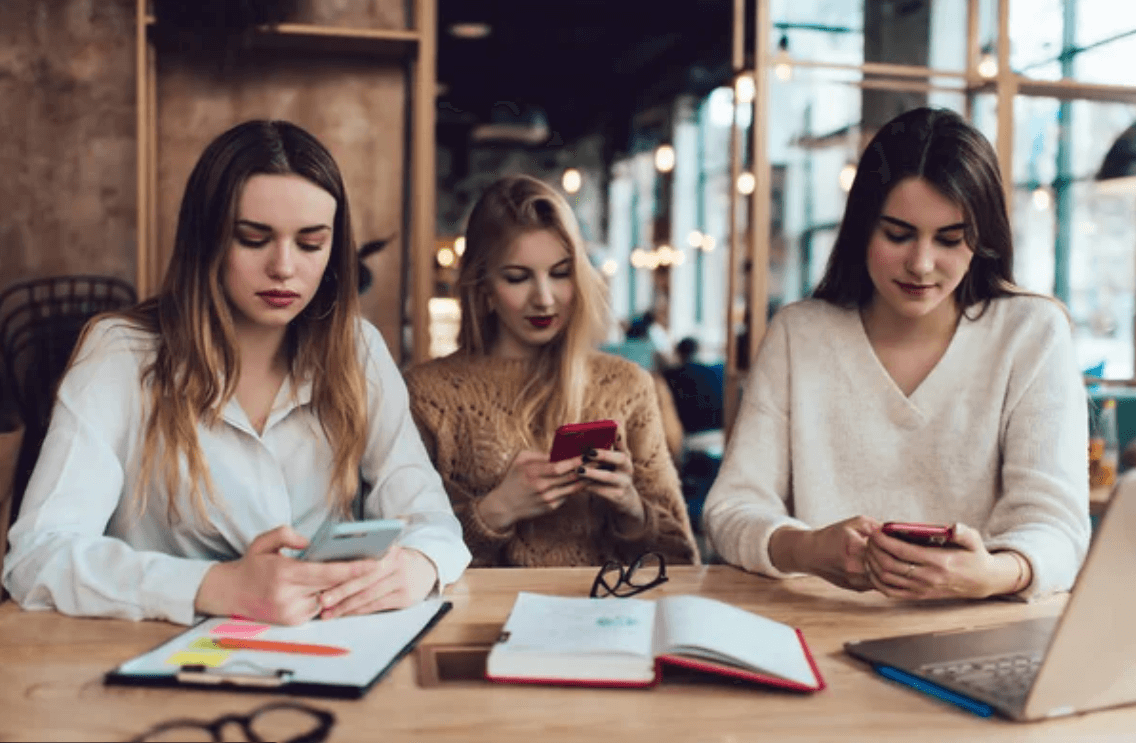 a view of a young child wearing headphones and using a tablet learning how to read faster