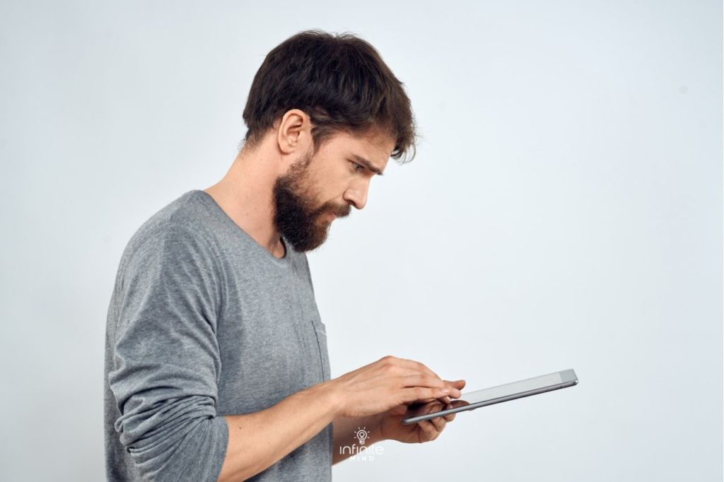 person focusing on tablet while using a brain training app to support processing speed