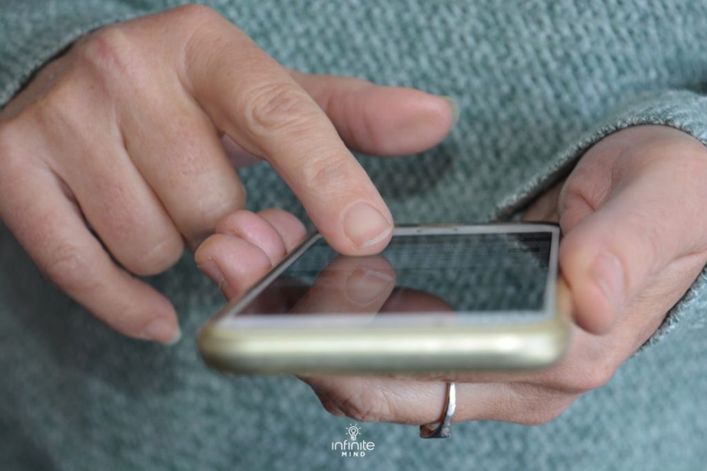 person using a smart phone for brain training games
