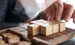 Person mentally rotating 3D shapes to train spatial reasoning.